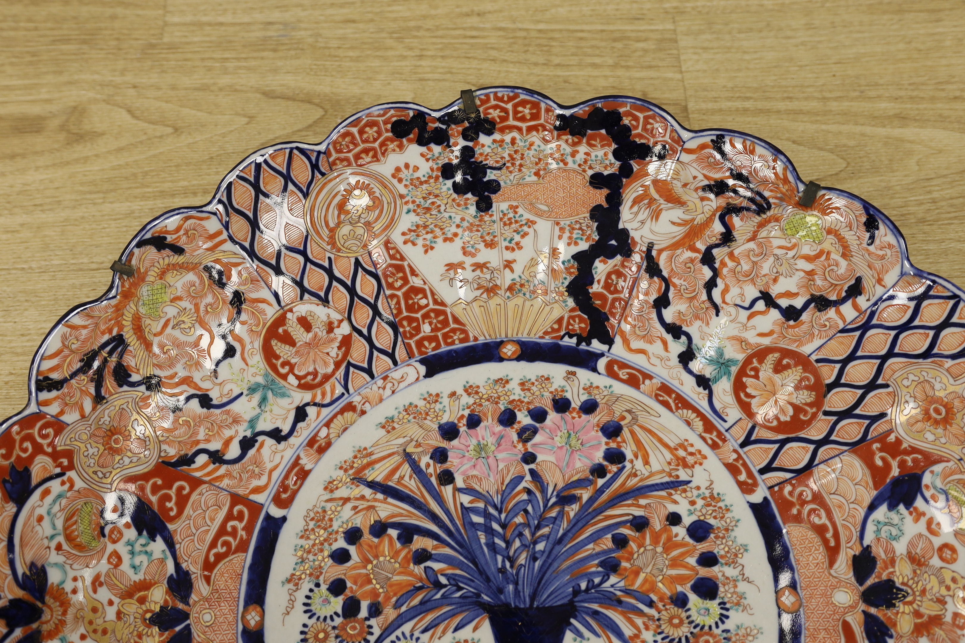 A large Japanese Imari floral charger, 58cm diameter